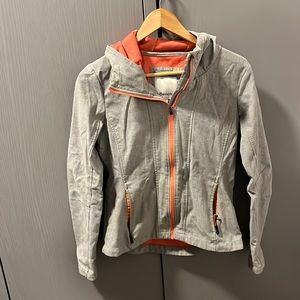 Light grey bench jacket with coral highlights. Size medium.